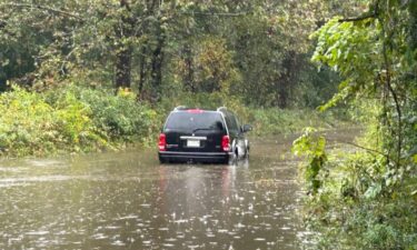 An SUV stranded by floodwaters in Transylvania County