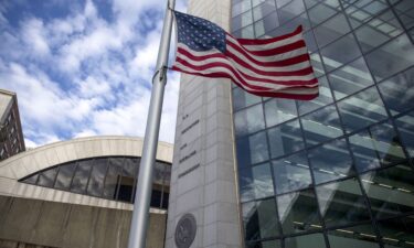 An American flag flies outside the headquarters building of the U.S. Securities and Exchange Commission (SEC) in 2018.