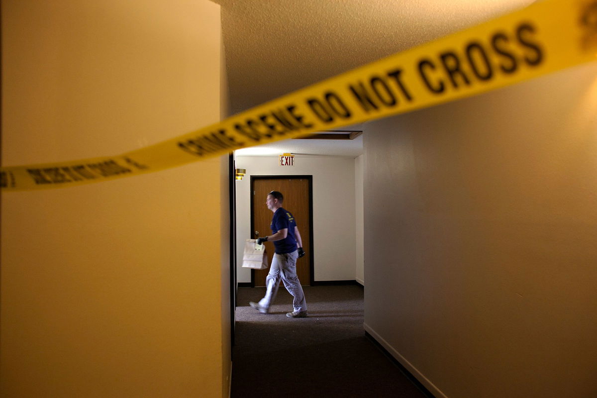 <i>Ann Arbor Miller/AP/File via CNN Newsource</i><br/>An FBI Evidence Response Team investigator walks behind a crime scene in July 2023 in Fargo