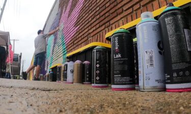 A brightly colored mural showcases the history and culture of Cleveland's Buckeye-Woodhill neighborhood.