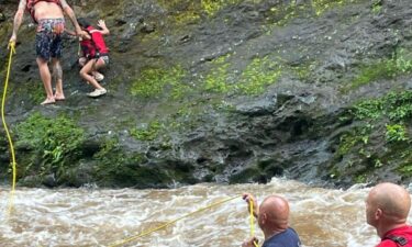 A girl and a man are safe from rising waters after Maui firefighters performed two rescues at Iao Valley.