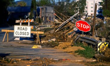 Debris covers a closed street near the Swannanoa River in Asheville