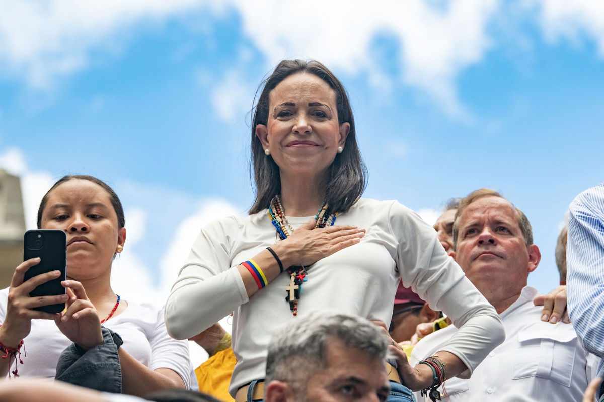 <i>Alfredo Lasry R/Getty Images via CNN Newsource</i><br/>Opposition leader Maria Corina Machado looks on with a hand in her chest during a protest against the result of the presidential election on July 30 in Caracas