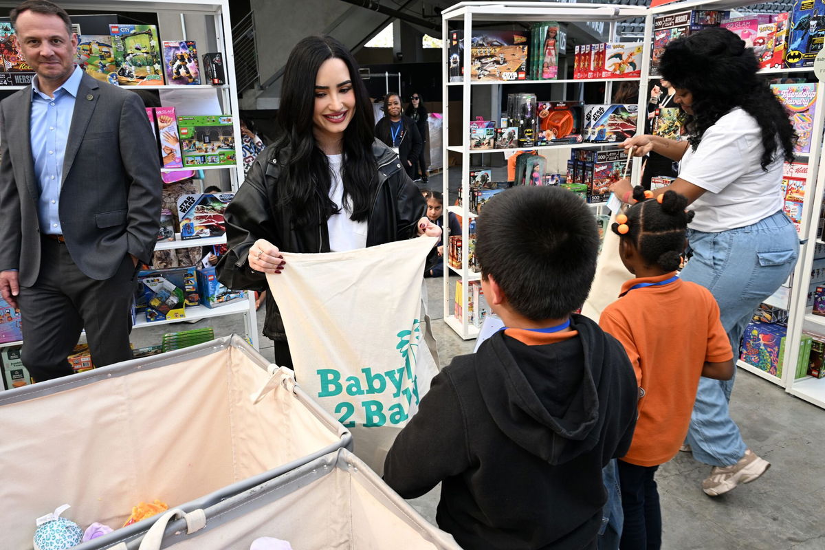 A heart-warming scene as celebrities help Christmas come early for children in South Los Angeles