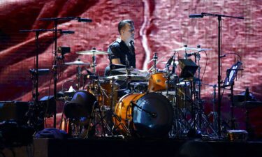 Larry Mullen Jr. of U2 performs at the National Stadium in Singapore on November 30