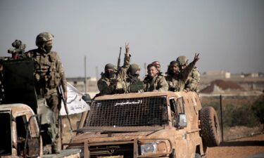 Syrian National Army fighters drive their vehicles from Aleppo to the Manbij frontline as part of Operation Dawn of Freedomon December 3