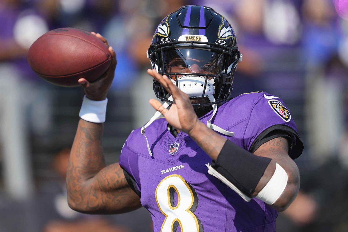 <i>Mitch Stringer/USA Today Sports/Reuters via CNN Newsource</i><br/>Baltimore Ravens quarterback Lamar Jackson warms up prior to the game against the Washington Commanders at M&T Bank Stadium on October 13.