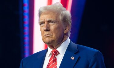 President-elect Donald Trump looks on during Turning Point USA's AmericaFest at the Phoenix Convention Center on December 22