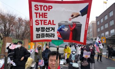 Protesters with both American and South Korean flags and 'Stop the Steal' placards gather to show support for the impeached-President Yoon Suk Yeol