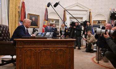 President Donald Trump speaks to the press in the Oval Office on January 23.