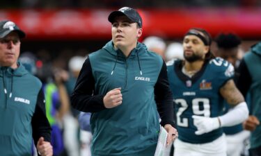 Offensive coordinator Kellen Moore jogs off the field at halftime before the Philadelphia Eagles' Super Bowl LIX victory over the Kansas City Chiefs at Caesars Superdome in New Orleans.