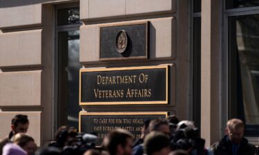 Members of the media stand near a rally outside the Department of Veterans Affairs headquarters in Washington