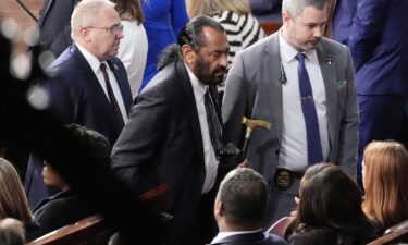 Rep. Al Green is escorted out as President Donald Trump addresses a joint session of Congress at the Capitol in Washington