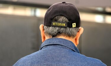 A US veteran looks over the names of Vietnam veterans at Fedde Middle School in Hawaiian Gardens