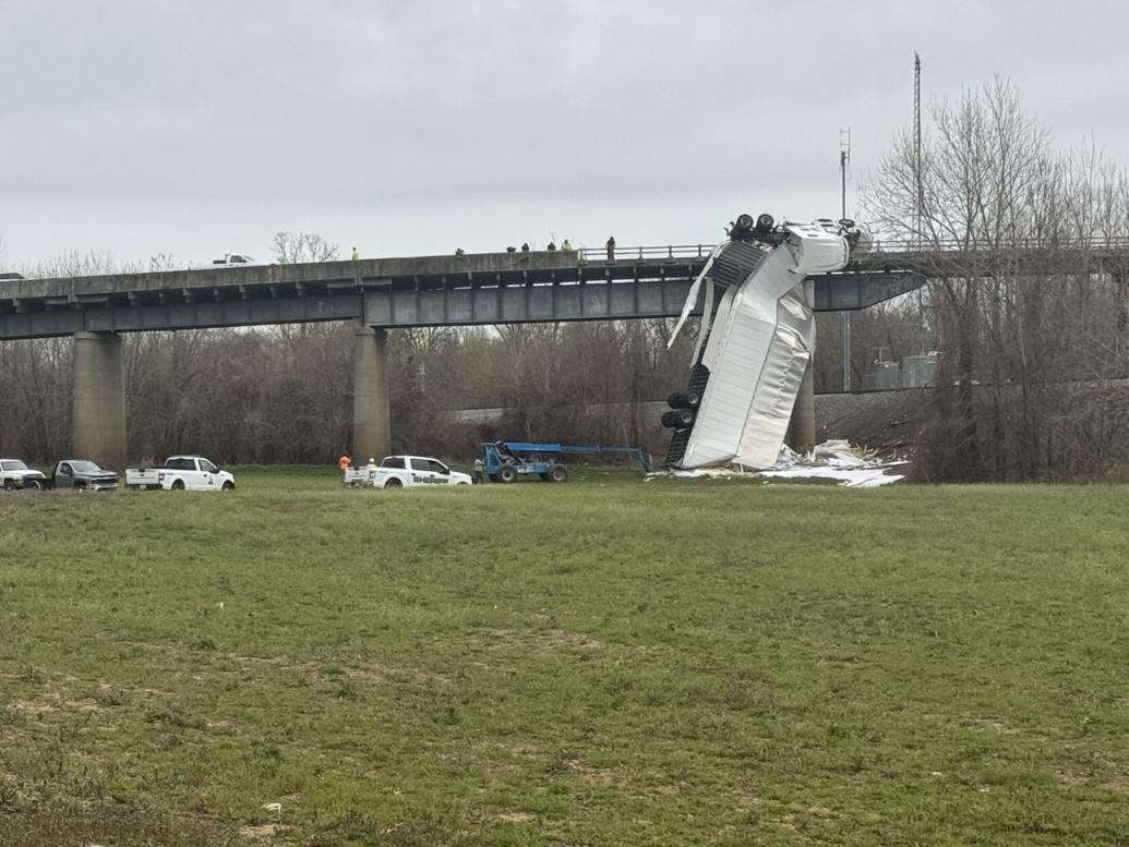 <i>Jasmine Youngblood/WPSD via CNN Newsource</i><br/>A semi-truck crash left a vehicle hanging by its cab from the US 51 Ohio River Bridge.