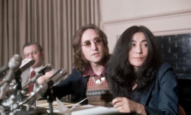 John Lennon and Yoko Ono are pictured outside the Robert Fraser Gallery in London in July 1968.