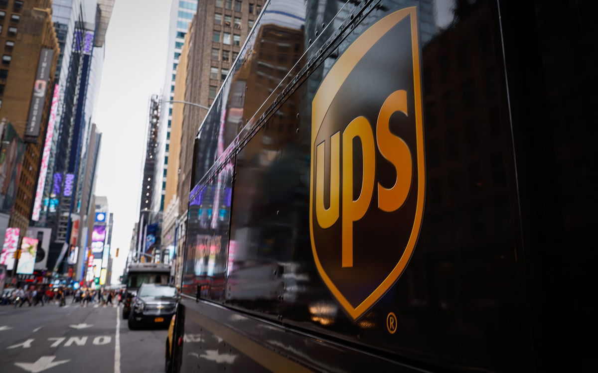 <i>Kena Betancur/VIEWpress/Corbis/Getty Images via CNN Newsource</i><br/>UPS will cut 20