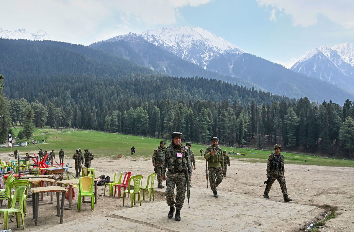<i>AP via CNN Newsource</i><br/>Indian security officers inspect the site where militants opened fired at tourists in Pahalgam