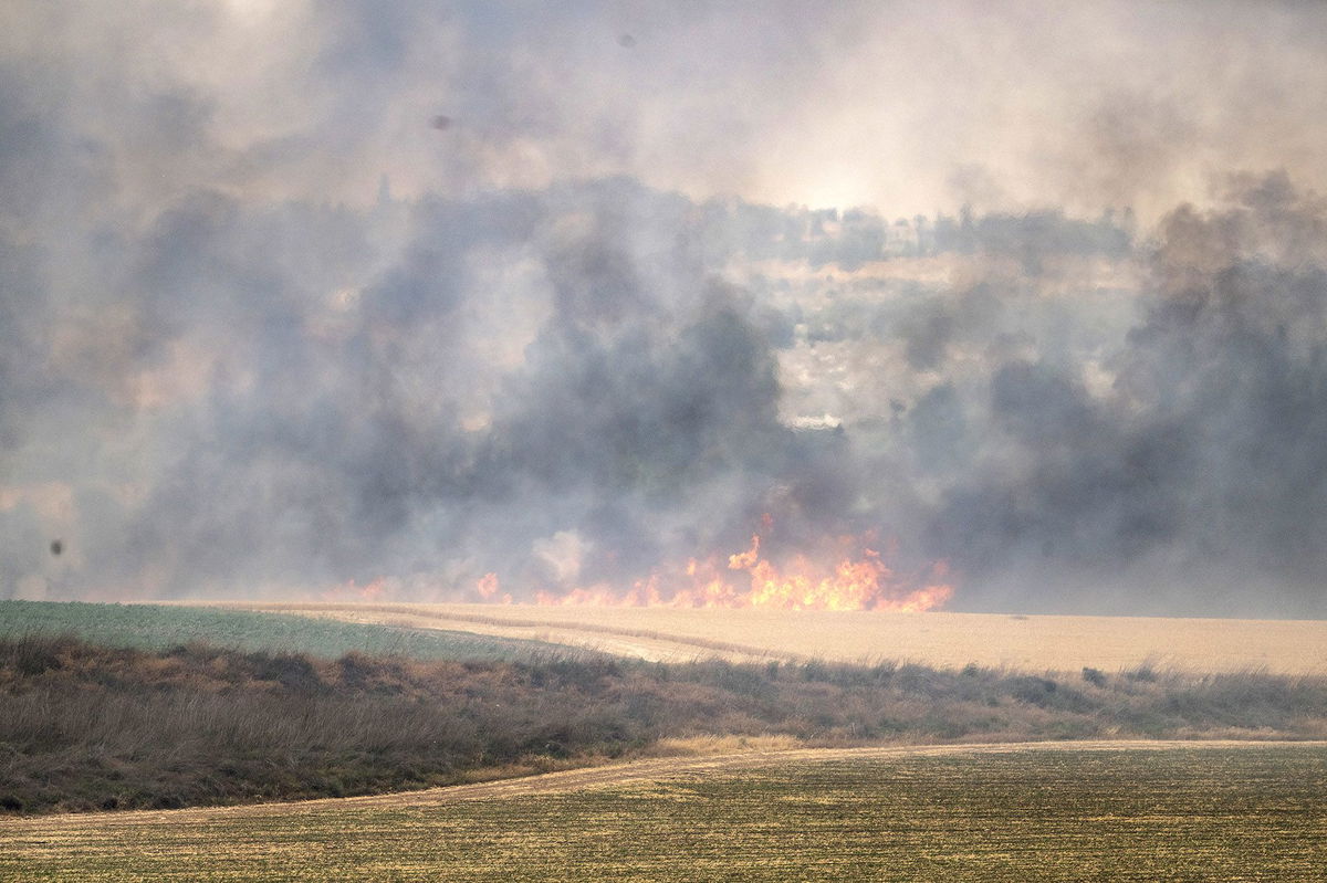 <i>Mostafa Alkharouf/Anadolu/Getty Images via CNN Newsource</i><br/>Smoke rises due to a fire in the forest area between Tel Aviv and Jerusalem on Wednesday.