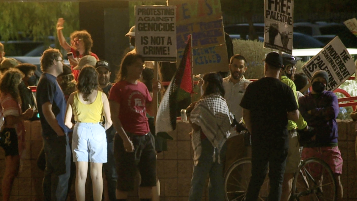 <i>KGUN 9/Kyler Van Vliet via CNN Newsource</i><br/>Protesters outside The Loft Theater before the 7:30 p.m. showing of