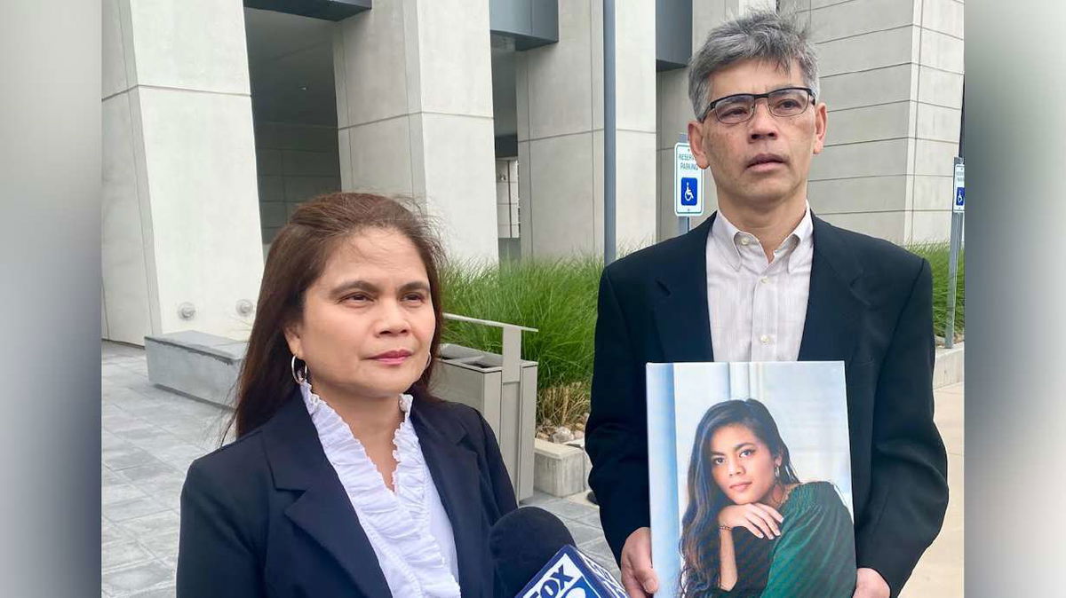<i>KSL via CNN Newsource</i><br/>Rose and Keith Nguyen hold a picture of their daughter