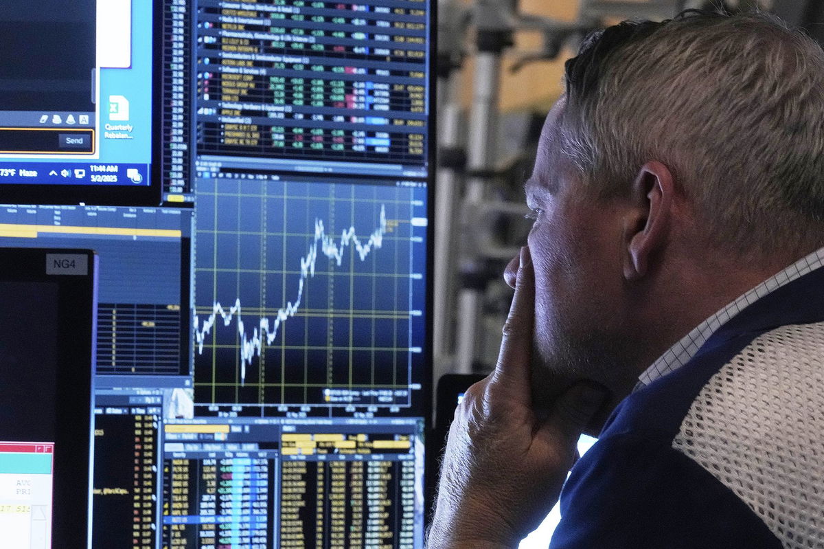 <i>Richard Drew/AP via CNN Newsource</i><br/>A trader works on the floor of the New York Stock Exchange on Friday