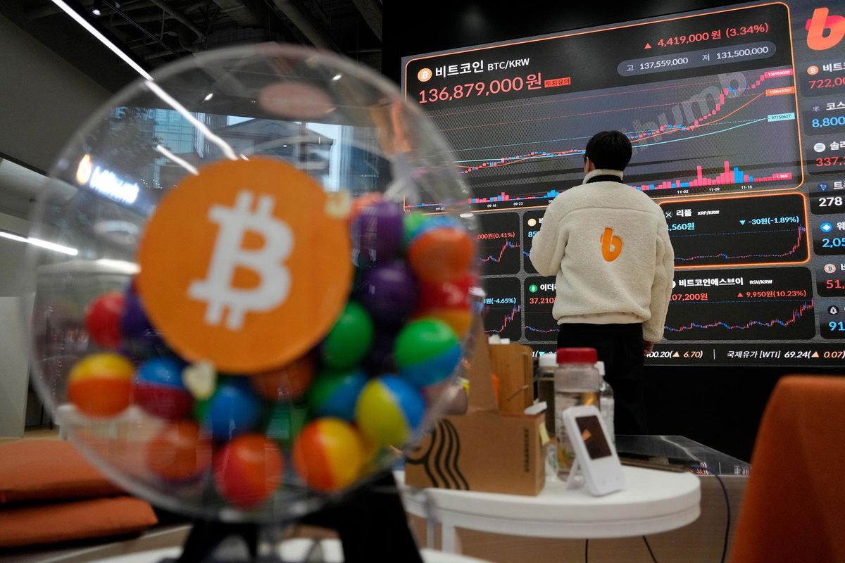 <i>Ahn Young-joon/AP via CNN Newsource</i><br/>An employee watches an electronic signboard displaying the prices of cryptocurrencies at the lounge of Bithumb cryptocurrency exchange in Seoul
