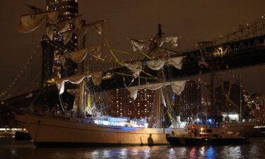 Sailors work on the yard arms of the Cuauhtémoc