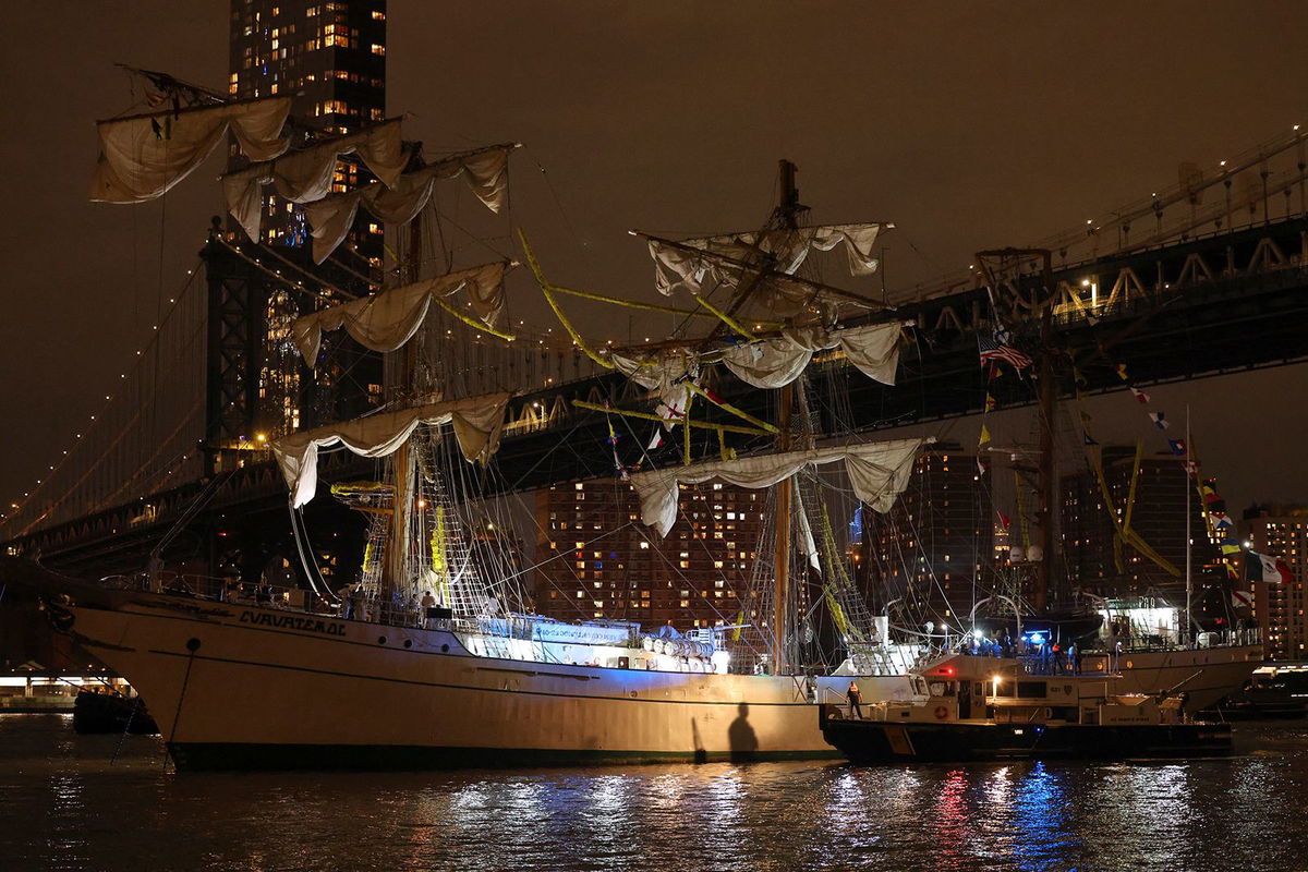 <i>Yuki Iwamura/AP via CNN Newsource</i><br/>Sailors work on the yard arms of the Cuauhtémoc