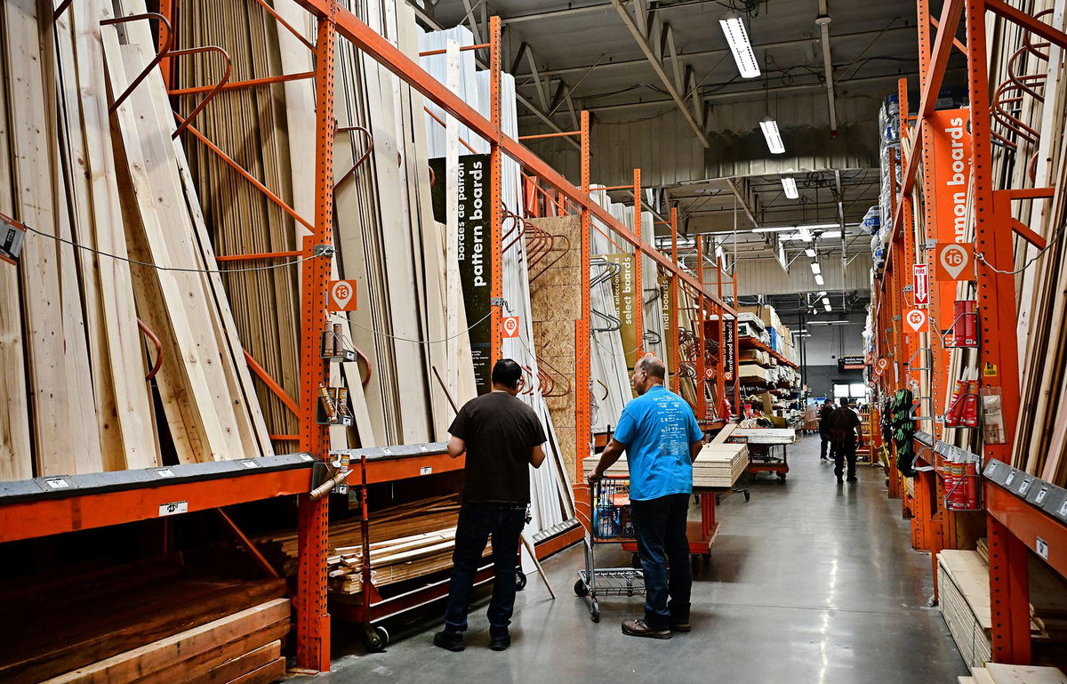 <i>Frederic J. Brown/AFP/Getty Images via CNN Newsource</i><br/>People shop for lumber from a Home Depot store in Alhambra