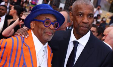 Spike Lee and Denzel Washington attend the "Highest 2 Lowest" red carpet at the 78th annual Cannes Film Festival at Palais des Festivals on May 19 in Cannes