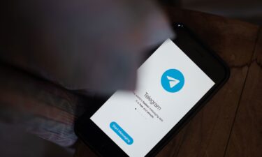 The Telegram messaging app is seen here on a smartphone. French authorities allege that dozens of men used the app to share abusive images of children.