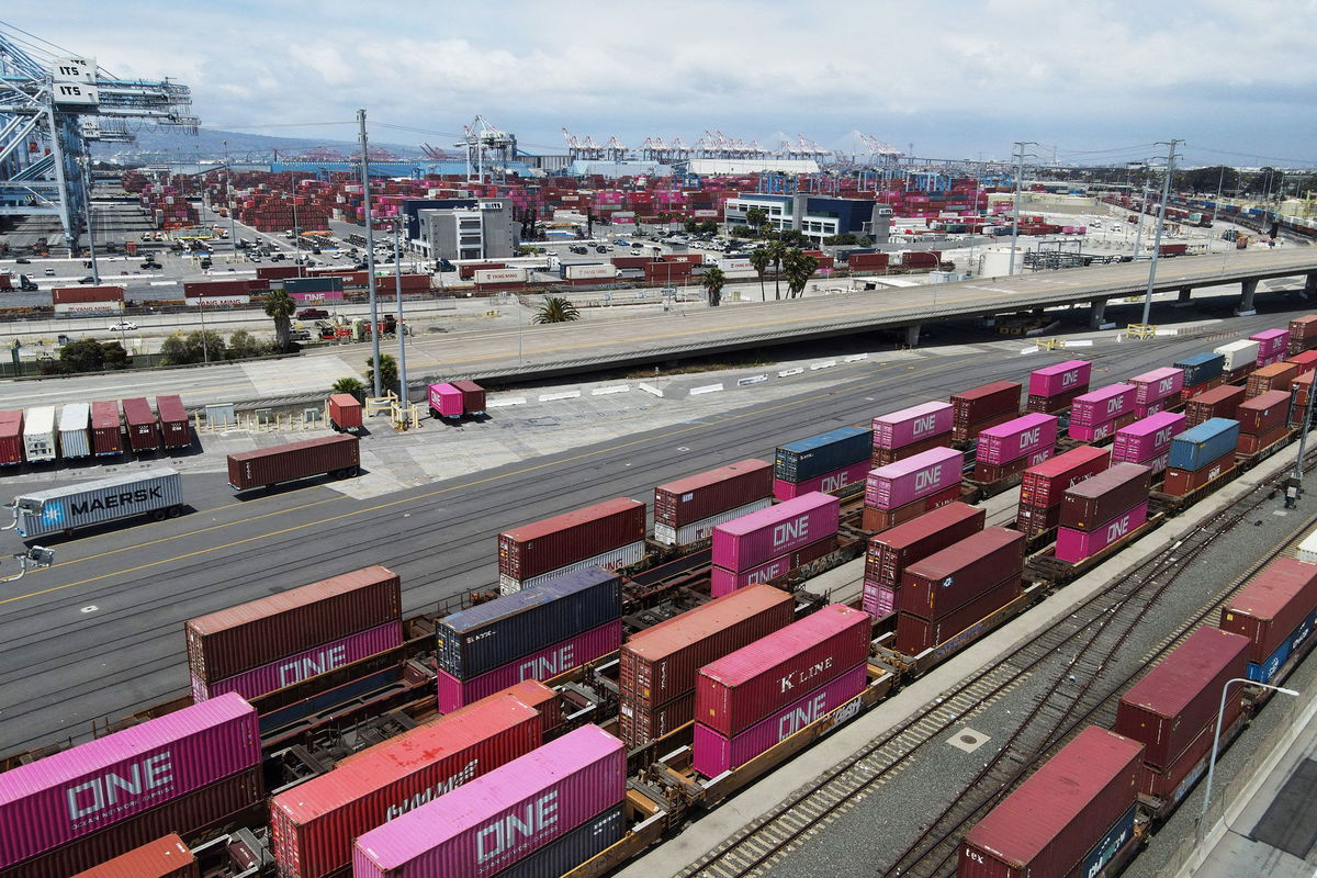 <i>David Swanson/Reuters via CNN Newsource</i><br/>Shipping containers sit on rail road tracks at the Port of Long Beach in Long Beach