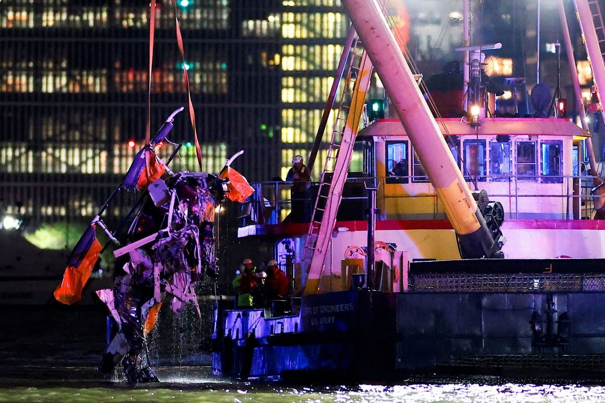 <i>Eduardo Munoz/Reuters via CNN Newsource</i><br/>Emergency personnel work at the scene of a helicopter crash on the Hudson River on April 10. The sightseeing helicopter that plunged in the Hudson River and killed six people in April “suddenly separated into three major sections.”