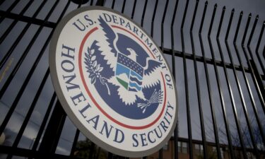 The U.S. Department of Homeland Security (DHS) seal hangs on a fence at the agency's headquarters in Washington