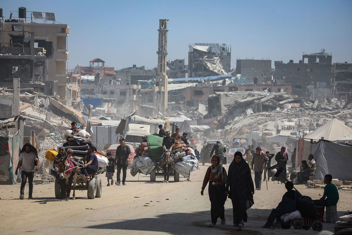 <i>Khames Alrefi/Anadolu/Getty Images via CNN Newsource</i><br/>Palestinians in the Gaza Strip flee with their possessions following intensified Israeli military attacks on May 16. The Israeli military says it has launched the first stages of a new major offensive in Gaza.