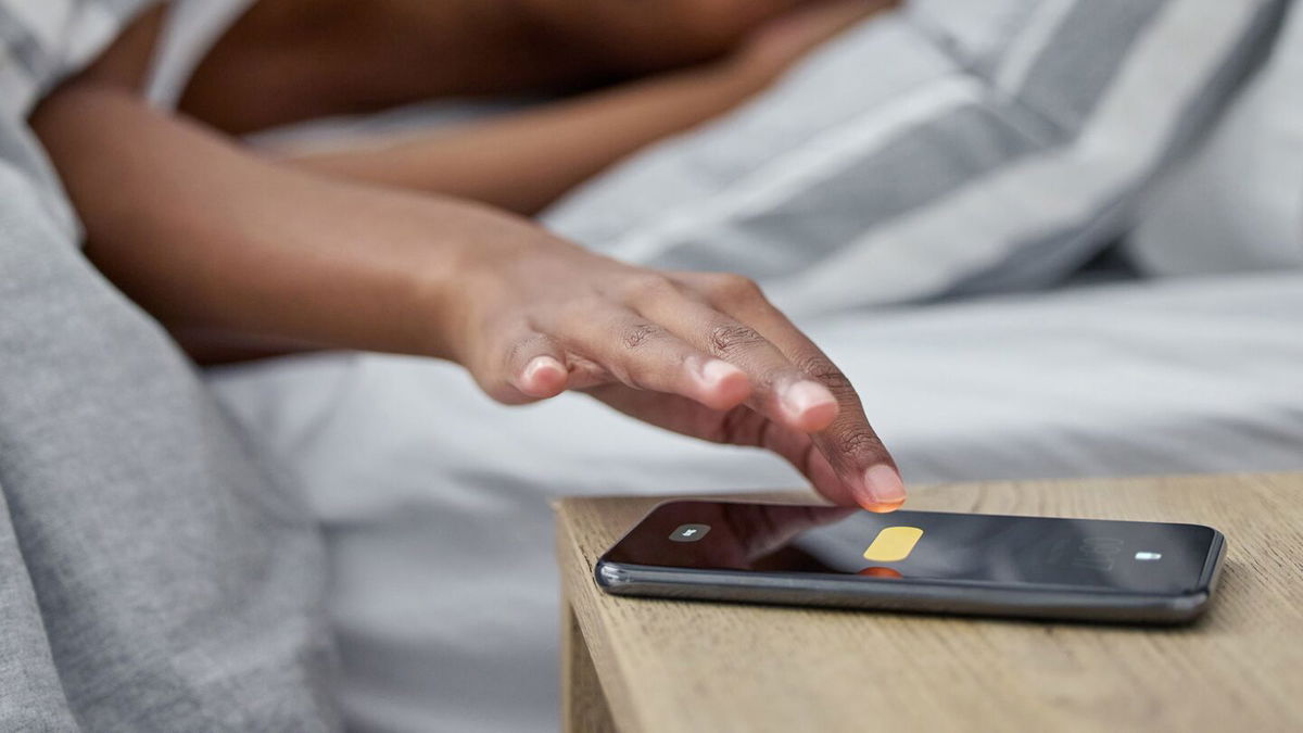 <i>PeopleImages/iStockphoto/Getty Images via CNN Newsource</i><br/>The snooze button has been a common feature of alarm clocks for decades.