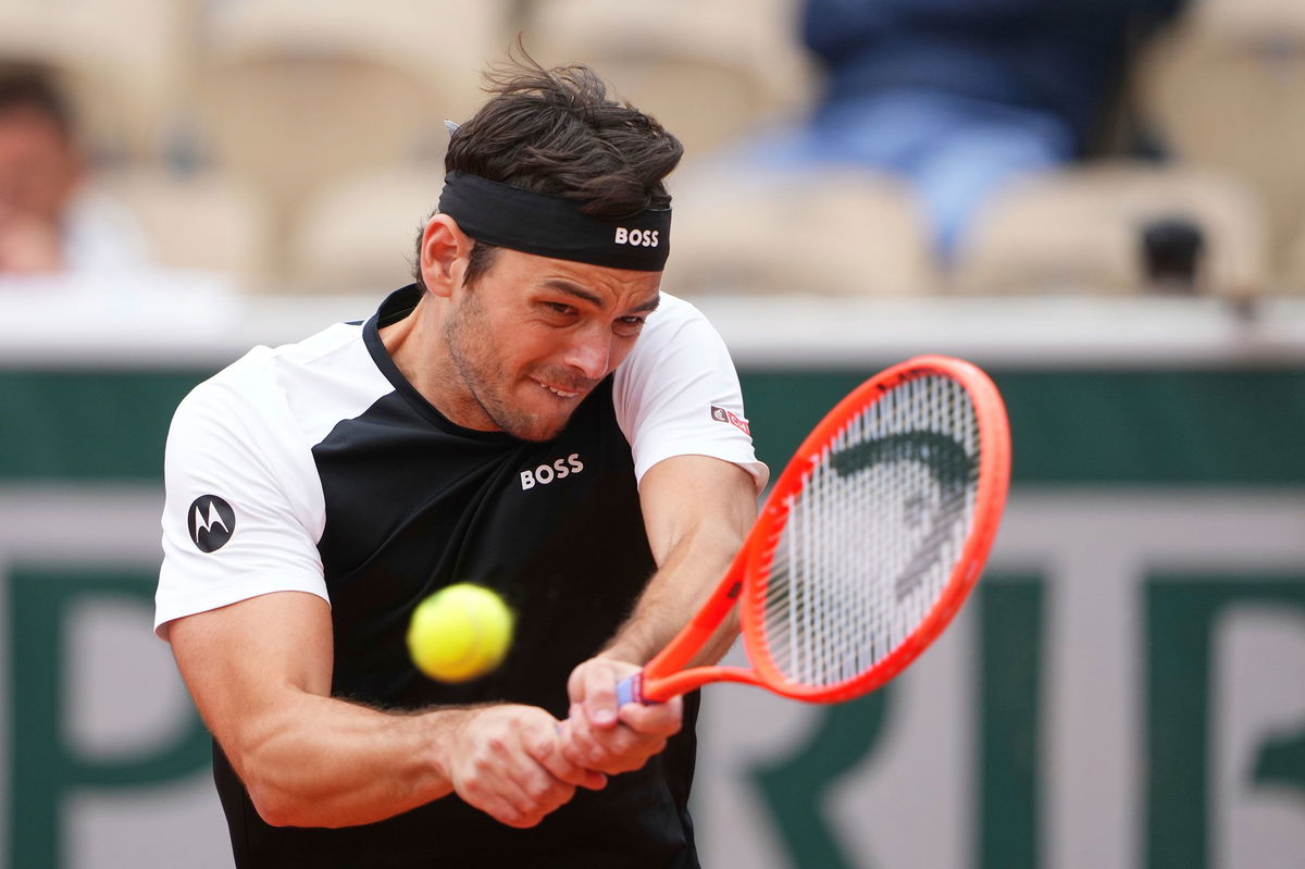 <i>Denis Balibouse/Reuters via CNN Newsource</i><br/>Altmaier (left) and Fritz shake hands after their first-round match.