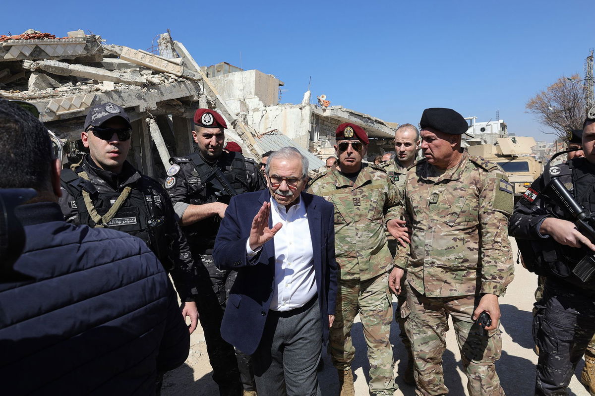 <i>Rabih Daher/AFP/Getty Images via CNN Newsource</i><br/>Lebanon's Prime Minister Nawaf Salam walks among Lebenese army soldiers as he visits the sourthern village of Khiam near the border with Israel
