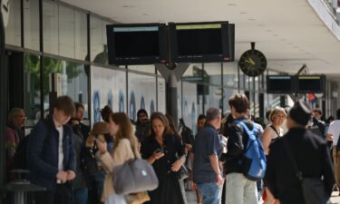 People waiting at a station after a significant power outage was reported by local authorities in Alpes-Maritimes in France on Saturday