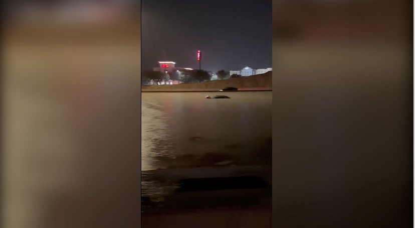 <i>@sanantonionursemidwife via CNN Newsource</i><br/>The roofs of some vehicles were seen peeking out of floodwaters on Interstate 35 just outside of San Antonio