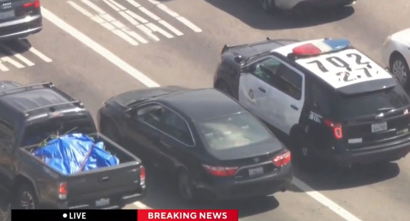 <i>KCAL/KCBS via CNN Newsource</i><br/>Los Angeles police are in pursuit of a reckless driver in the Mid-City area. SkyCal was overhead when the driver pulled up behind another LAPD patrol car at an intersection.