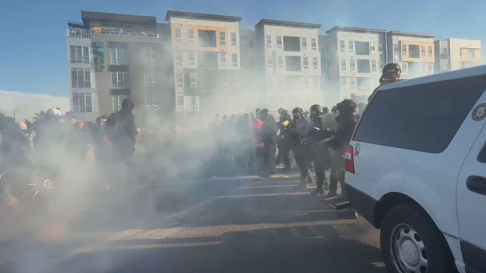 <i>KCNC via CNN Newsource</i><br/>Denver police officers deployed pepper balls and smoke at one group of protesters at the