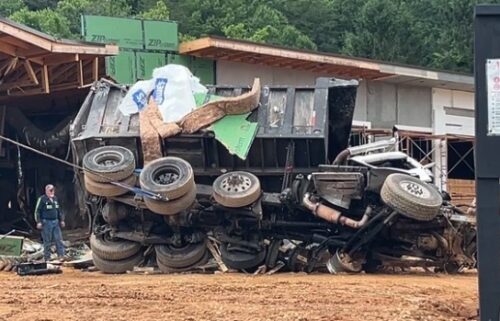 The scene of a fatal crash is pictured near Exit 73 along Interstate 40 in Old Fort. Police say the dump truck lost its brakes and exited the interstate before going airborne and crashing into the building.