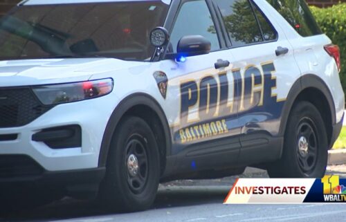 A nearly 17-hour mental health crisis ended peacefully after a man was pulled from a 13th floor balcony by a Baltimore police officer Wednesday.