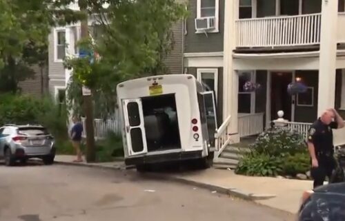 More than a dozen people were taken to the hospital Wednesday after a passenger van crashed into a building in Boston's Dorchester neighborhood.