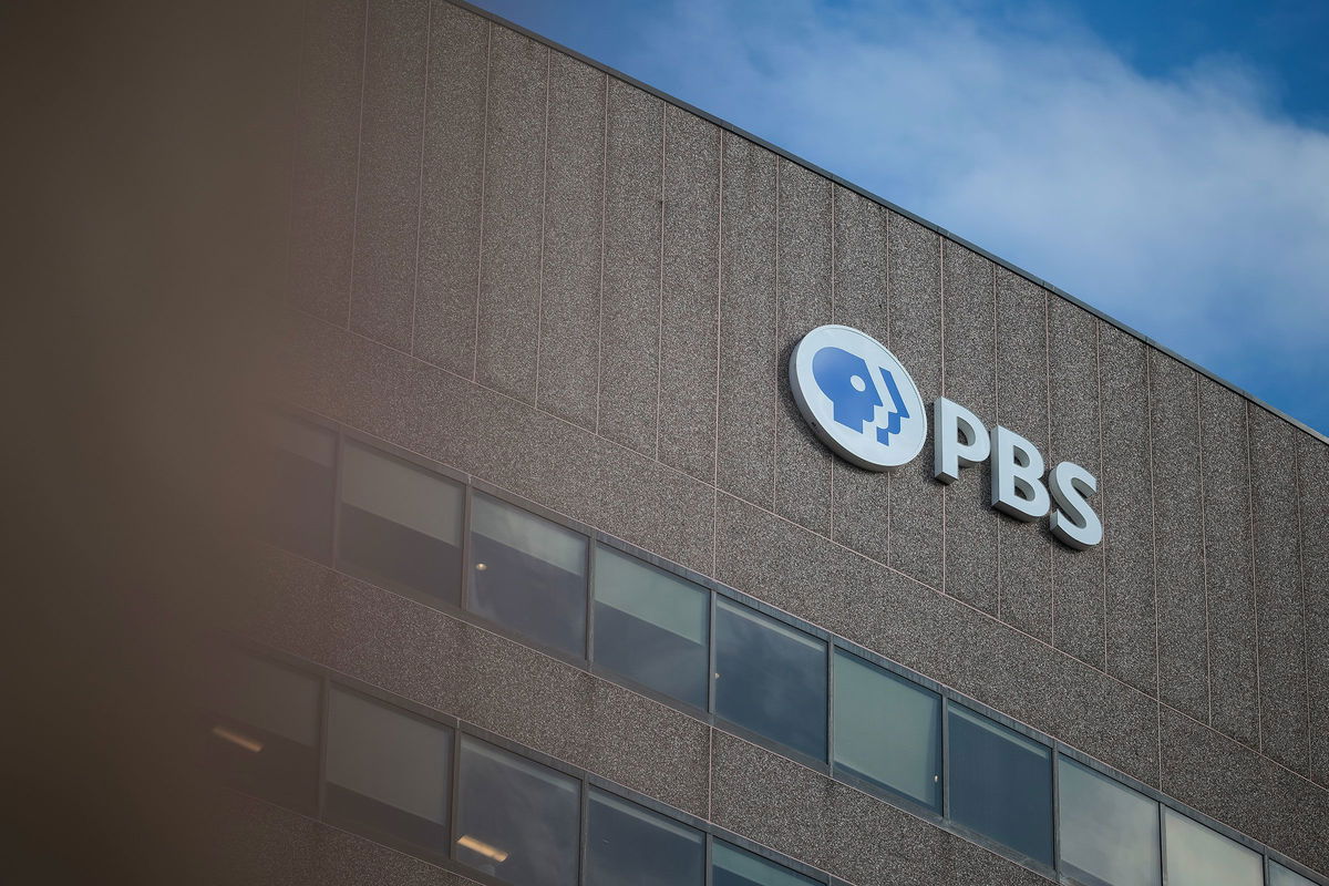 <i>Kayla Bartkowski/Getty Images via CNN Newsource</i><br/>A sign for the Public Broadcasting Service is seen on its building headquarters in Arlington