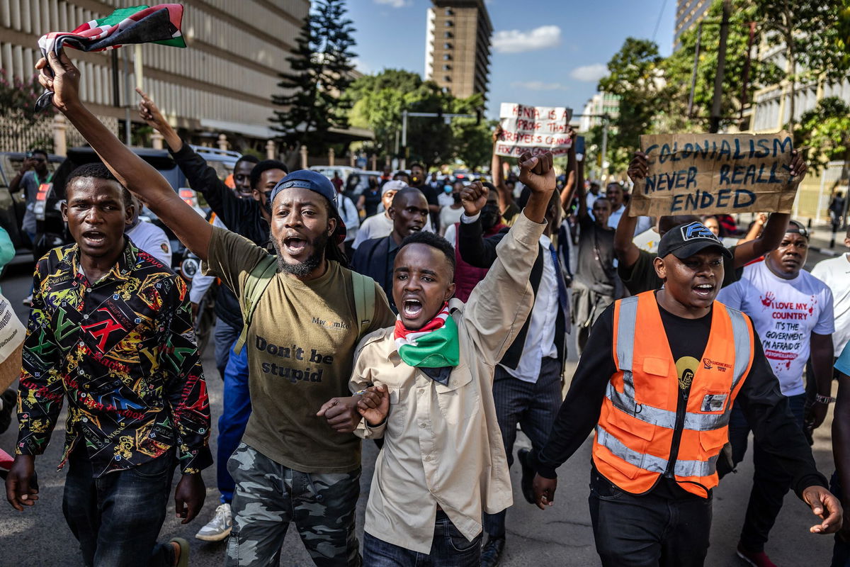 <i>Luis Tato/AFP via Getty Images via CNN Newsource</i><br/>Protesters chant anti-government slogans as they march to the National Police Service headquarters demanding the resignation of senior officers following the death of Albert Ojwang in police custody.