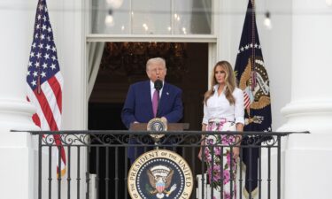 President Donald Trump speaks as first lady Melania Trump listens during the congressional picnic on the South Lawn of the White House on June 12 in Washington.