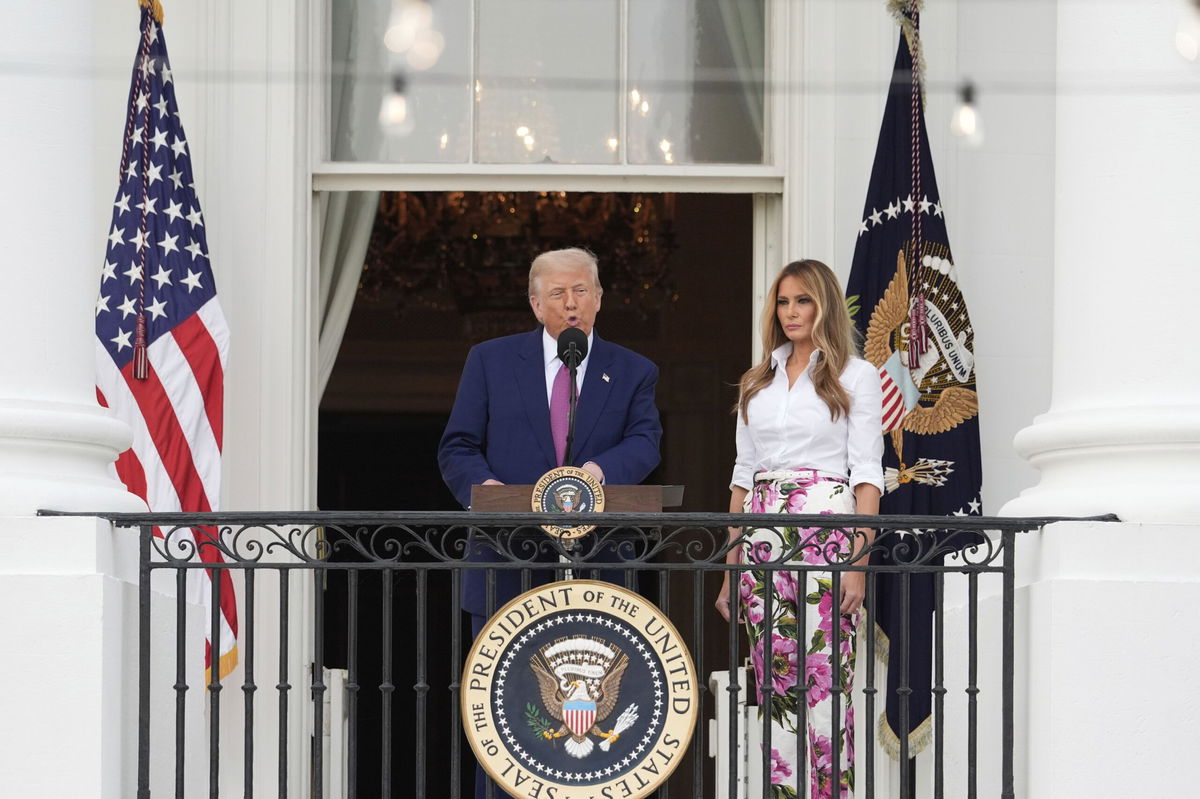 <i>Alex Brandon/AP via CNN Newsource</i><br/>President Donald Trump speaks as first lady Melania Trump listens during the congressional picnic on the South Lawn of the White House on June 12 in Washington.